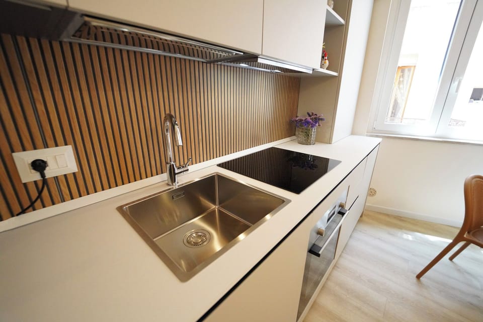 Mini-fridge, stovetop, cookware/dishes/utensils