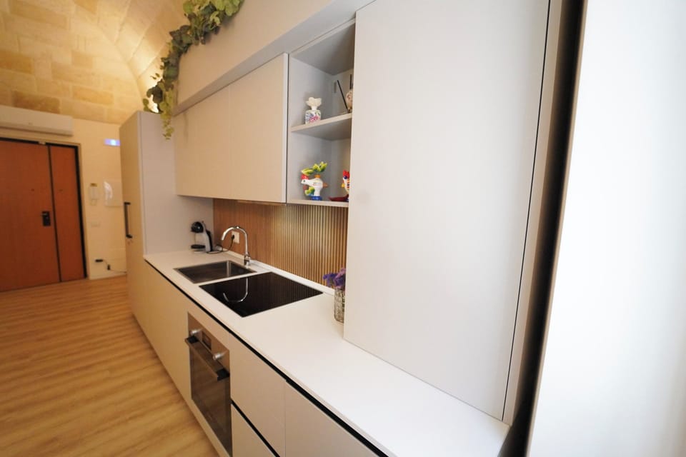 Mini-fridge, stovetop, cookware/dishes/utensils