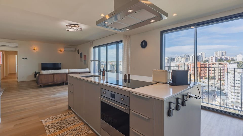 Sleek, fully equipped kitchen with modern appliances and a central island, perfect for cooking at home or enjoying a relaxed breakfast with a view.
#ModernKitchen #DesignApartment #Portugal #PT #Lisbon #Oeiras #Miraflores