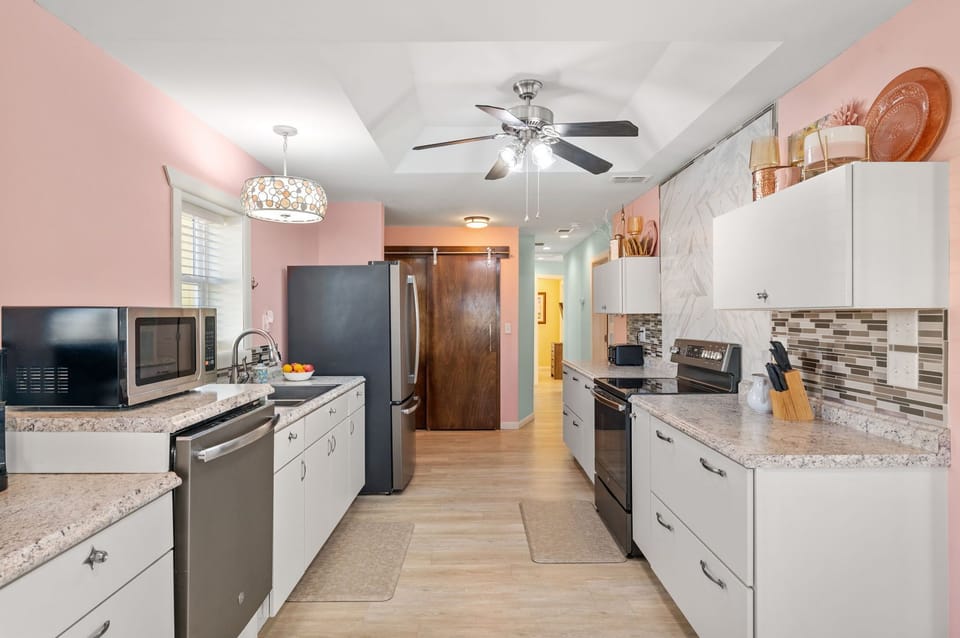 Your fully equipped galley kitchen features granite counters, stainless appliances, and everything needed for home cooking during your stay.