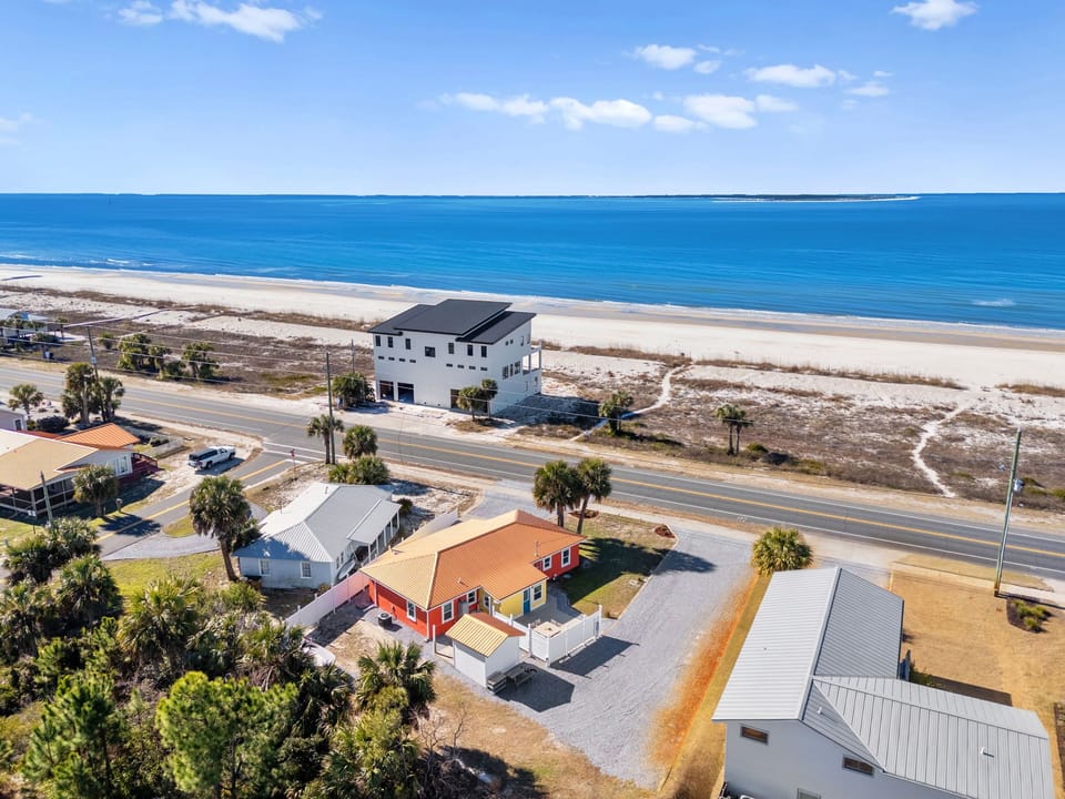 Beachfront property location with pristine sandy shores and crystal-clear waters just steps away from your coastal retreat.