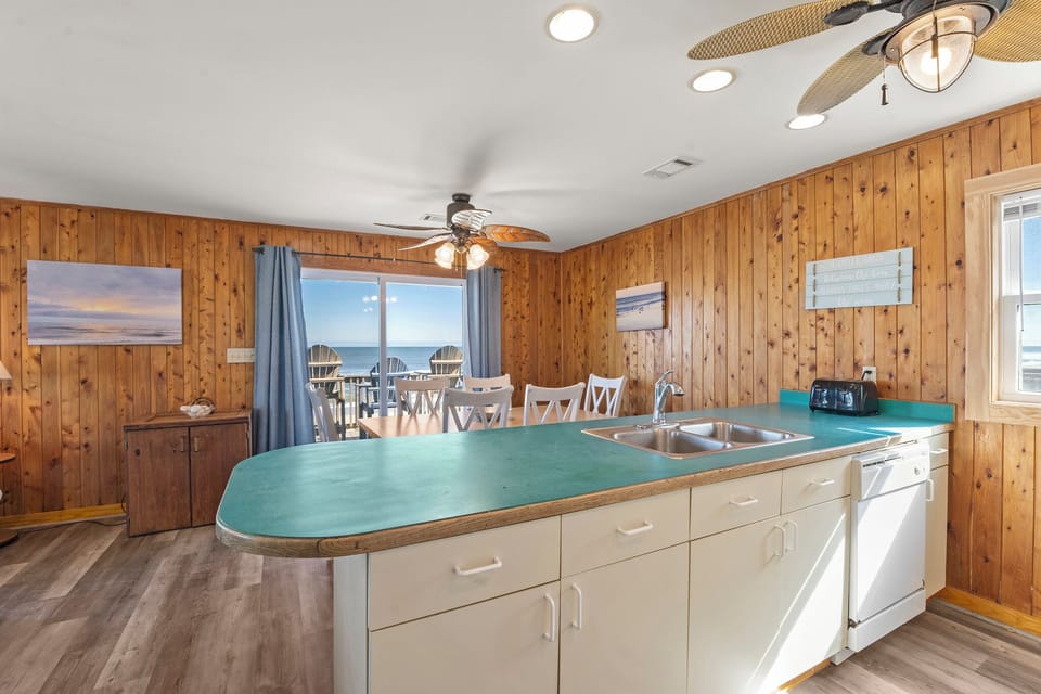 SN0421: Pelican Sunrise | Mid Level Kitchen Into Dining Area