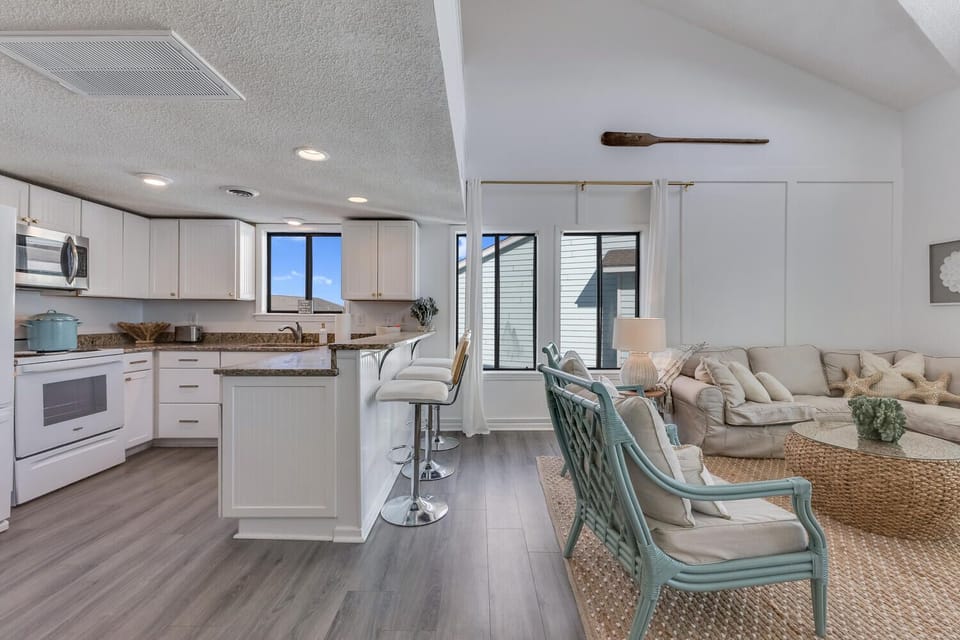 Your open-concept living space flows seamlessly from kitchen to lounge, perfect for gathering with loved ones in comfort.