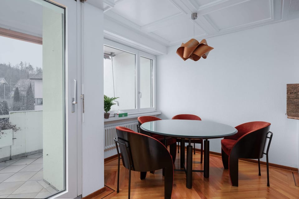 Dining area with natural light and balcony access