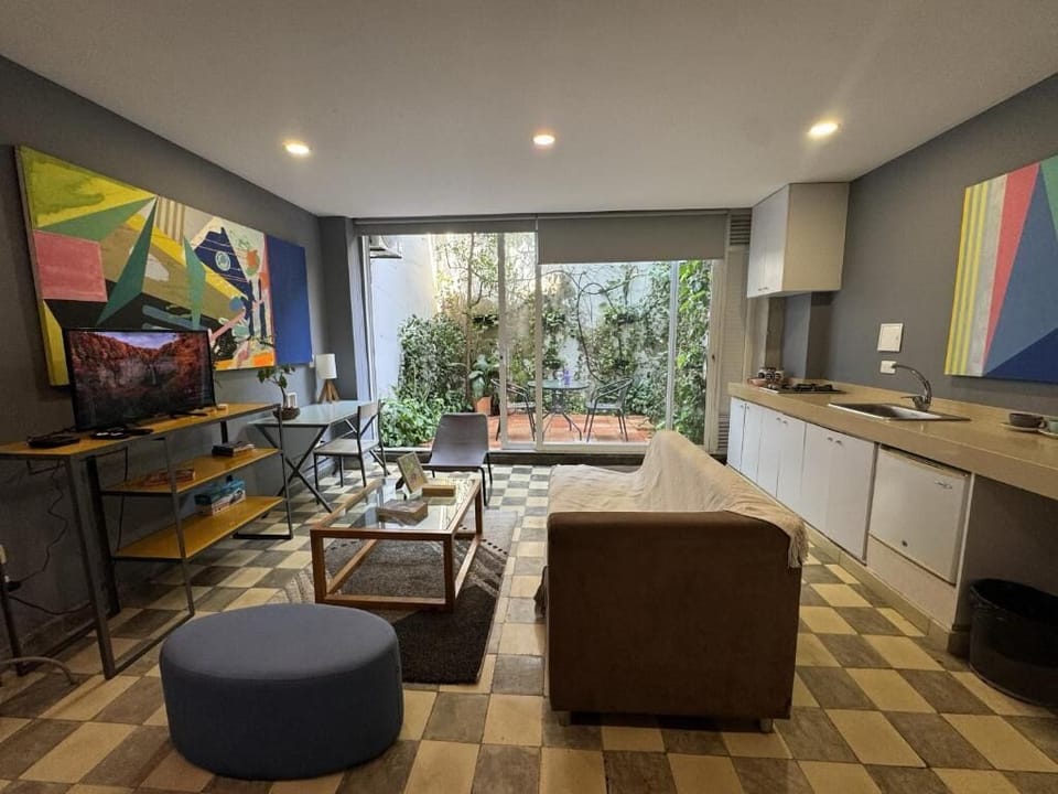 Suite, Balcony, Courtyard View | Living area | TV