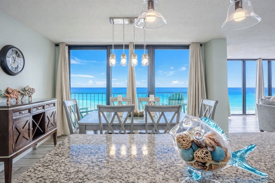 Dining with a view! Looking over our island to the dining table and balcony