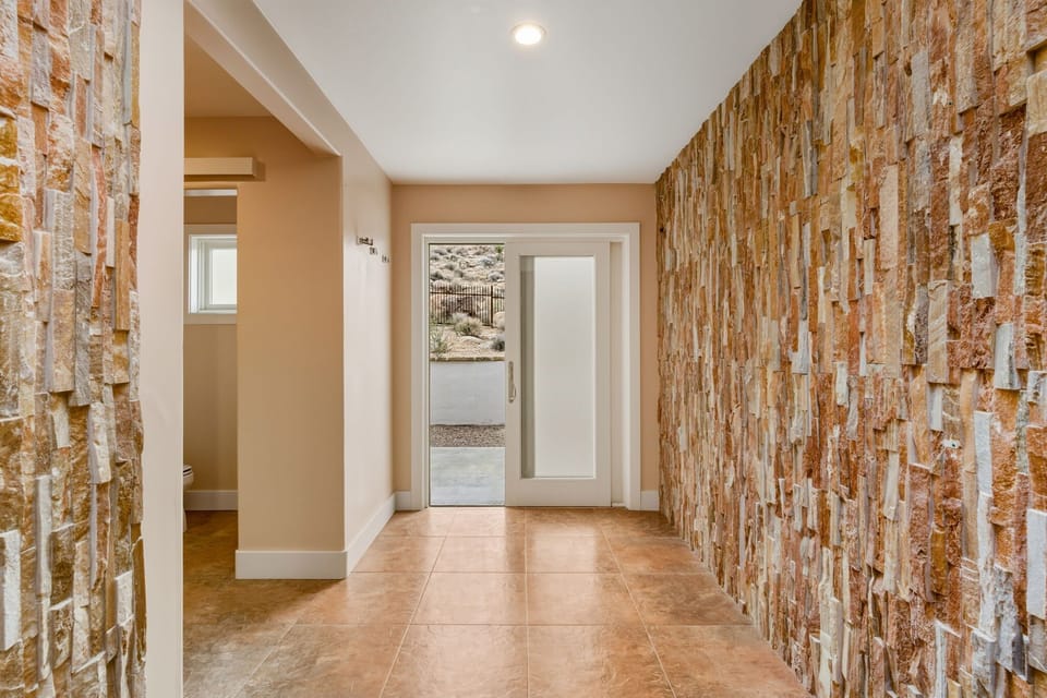 Slider leading out of master bathroom showers to backyard. 