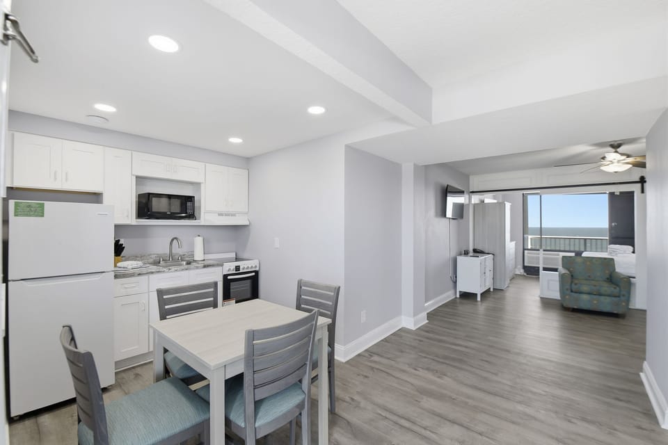 A seamless blend of functionality and aesthetics, this space offers convenient dining and socializing with easy access to beachfront views.