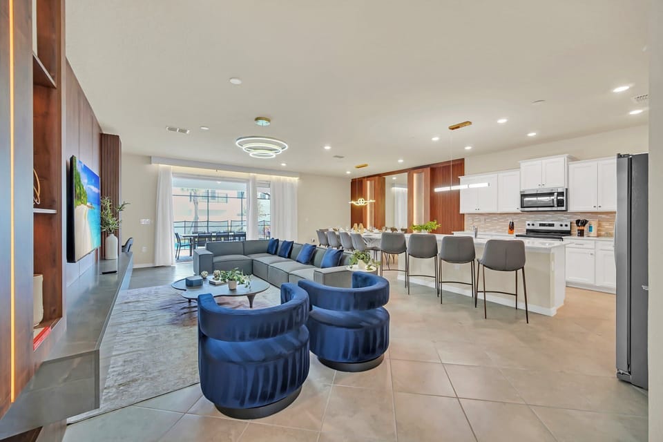Open-concept living area with modern kitchen and ample seating for gatherings.