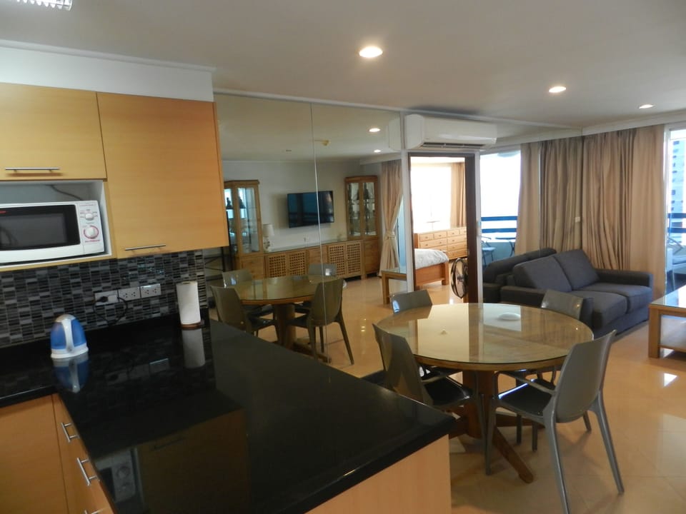 Design Apartment, 2 Bedrooms, Refrigerator & Microwave, Sea View | Living room | 65-cm flat-screen TV with cable channels, TV