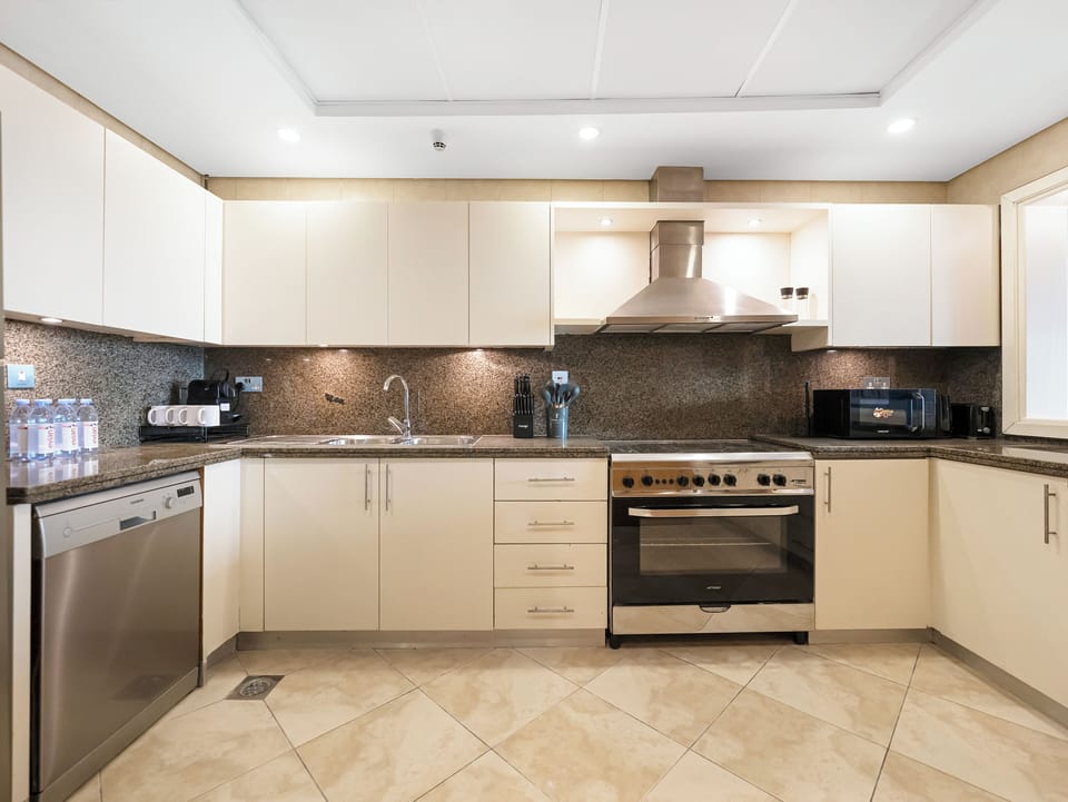 Signature Penthouse, Beach View | Private kitchen | Coffee/tea maker, electric kettle
