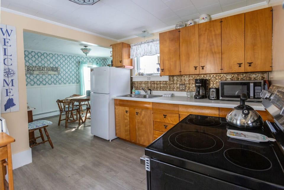 Enter the home through a comfortable kitchen - plenty of pots, pans, and everything else you may need during your stay