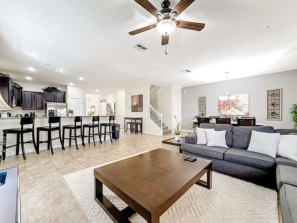 Open living area with cozy seating and breakfast bar.