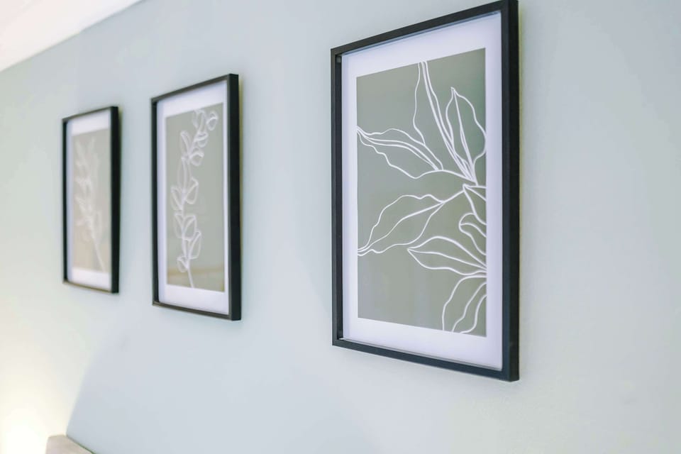 Artistic Retreat: Elegant line art frames add a touch of sophistication to your serene stay!
