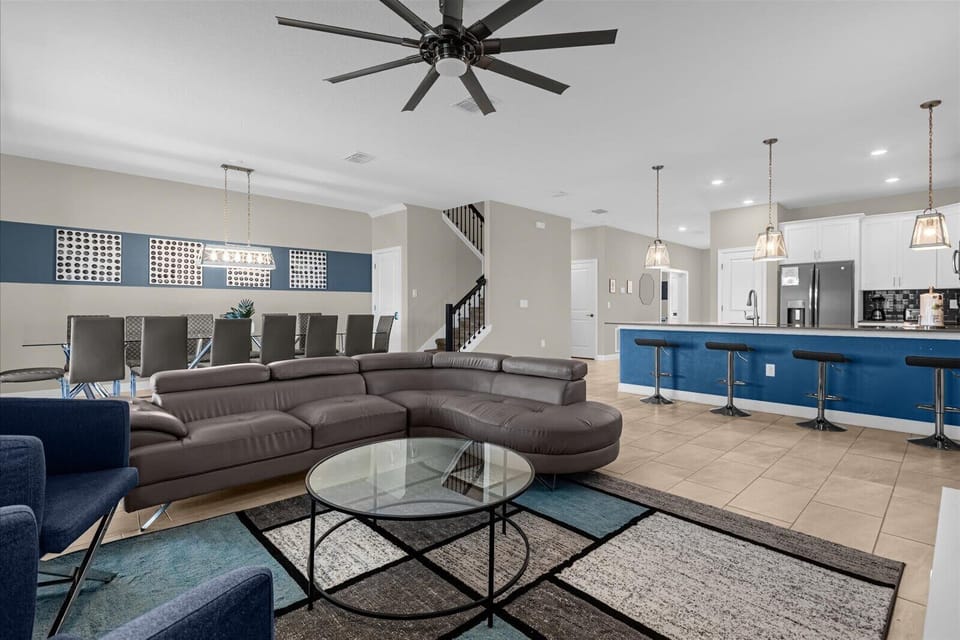 Open-concept layout connects the living room, dining area, and kitchen — ideal for large groups and family gatherings.