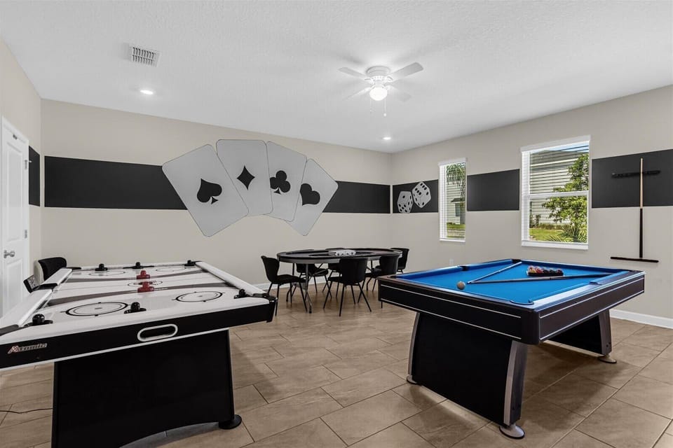 Epic game room packed with fun — pool table, air hockey, and poker table for nonstop entertainment