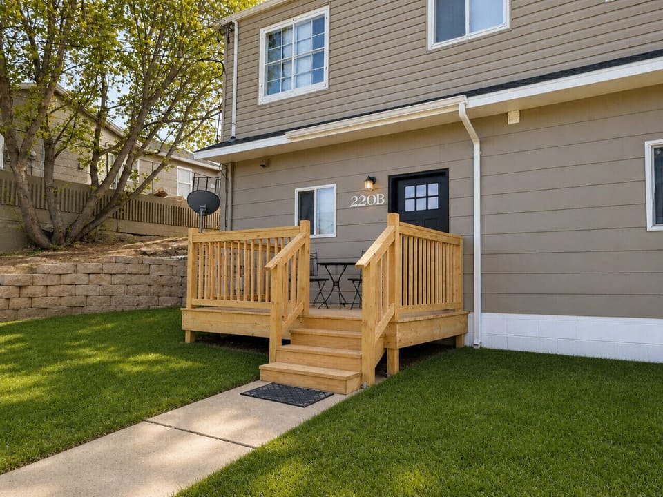 Front deck attached to the home, offering a comfortable outdoor space to relax