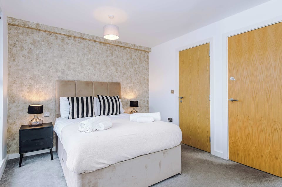 Stylish Bedroom Retreat: Embrace comfort with chic decor and plush bedding for a peaceful night's rest!