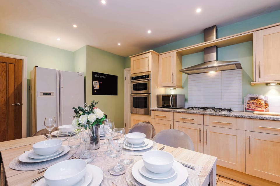 Kitchen Delight: Modern appliances and elegant dining set for memorable meals together!