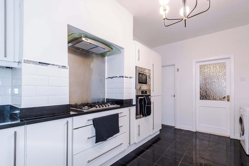 Sleek Kitchen: Whip up culinary delights in this modern, stylish space with ample amenities!