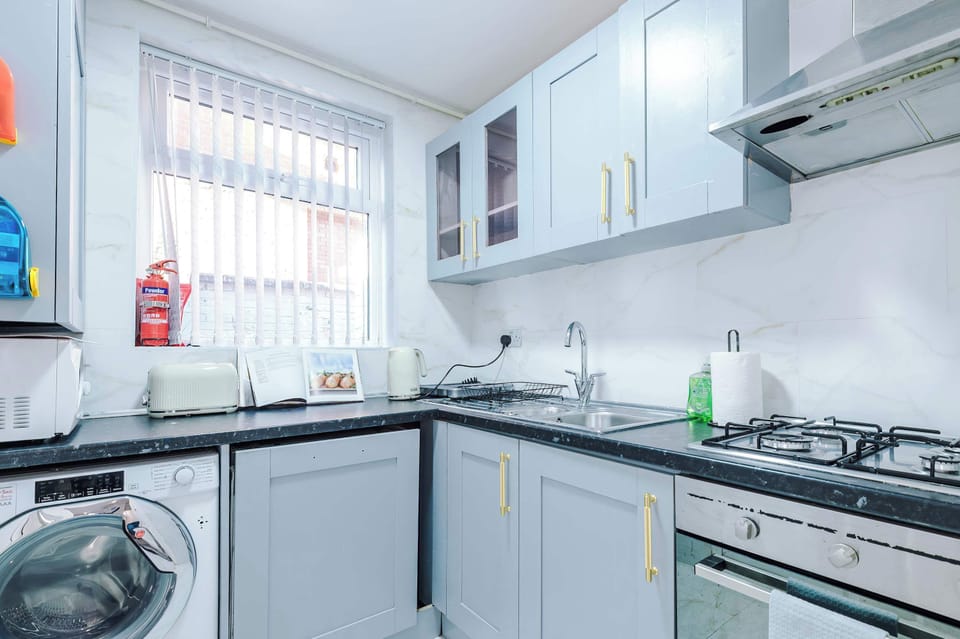 Kitchen: Modern appliances and sleek design for culinary adventures in Greater Manchester!