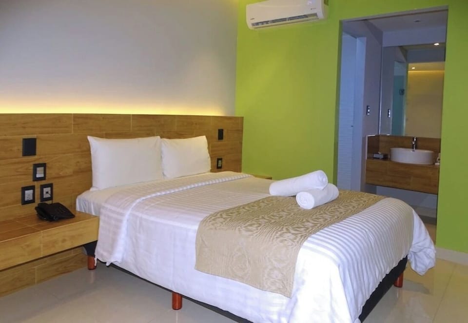 Recharge in a modern king room with cool AC comfort.