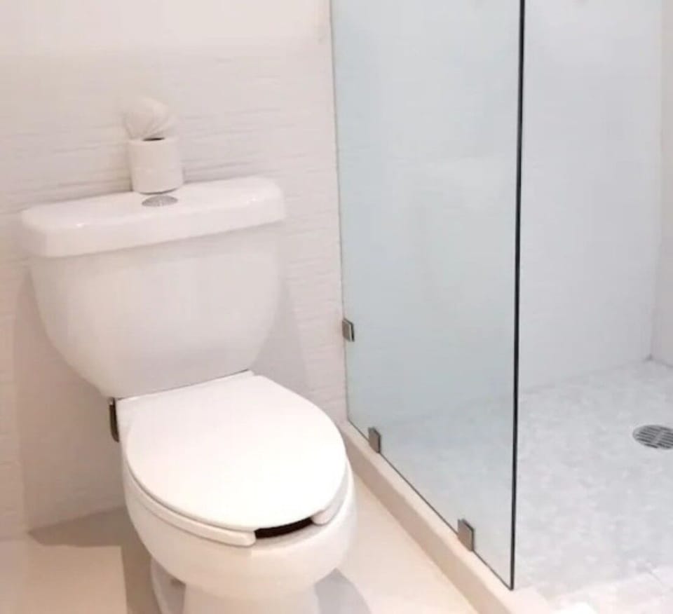Rinse off in a simple walk-in shower after adventures.