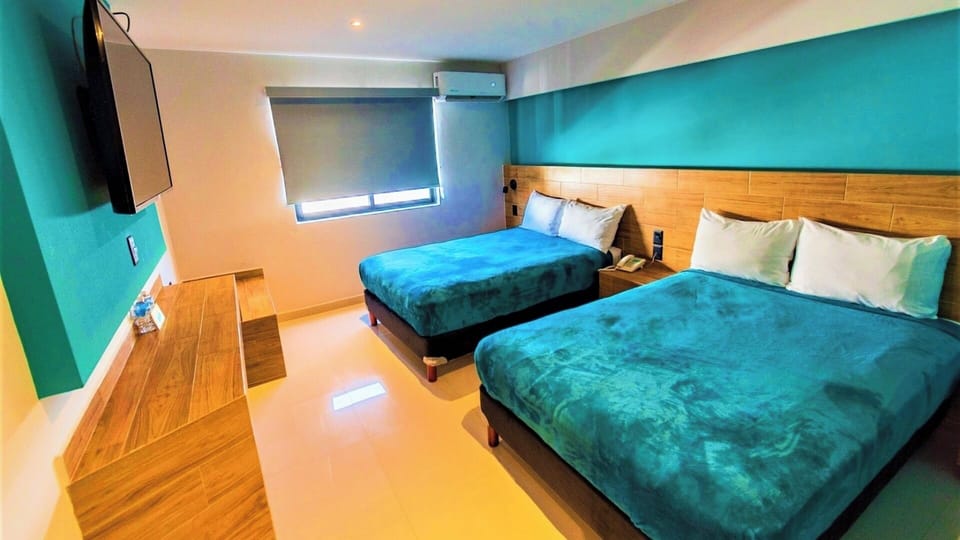Stretch out in a bright room with two comfy beds.