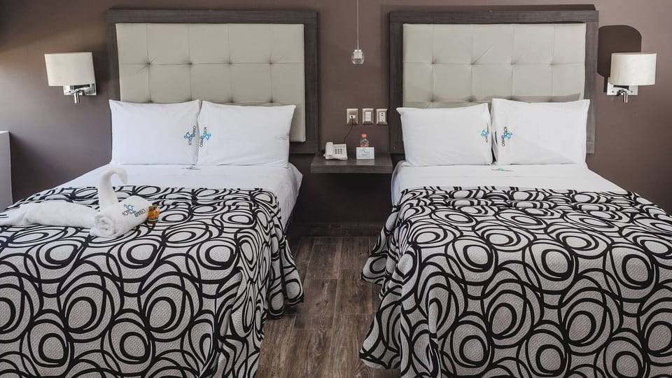 Sink into quiet comfort with bedside lighting for easy evenings.