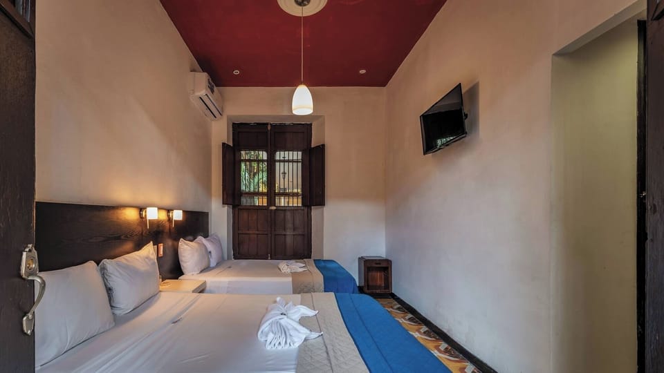 Settle in after exploring, with tidy beds and calm lighting
