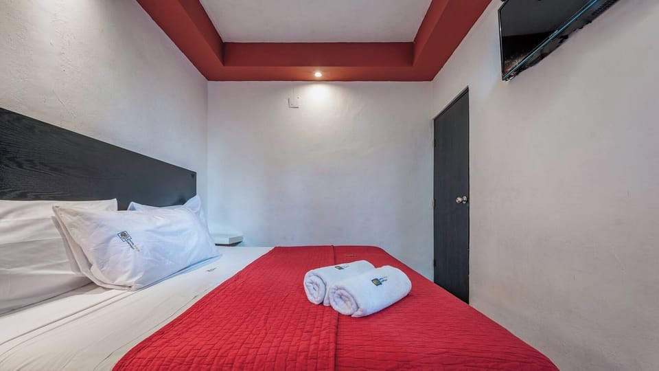Recharge in simple comfort with fresh towels and soft bedding