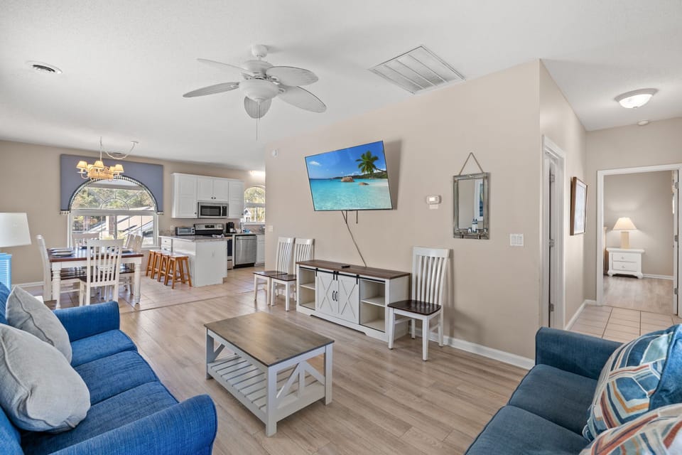 Upstairs living room with Smart TV - seamless flow between living room, dining, and kitchen