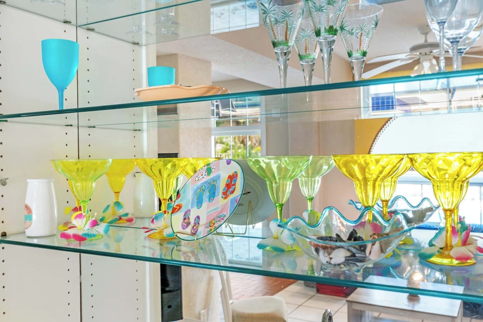 Well-stocked kitchen with glassware, serving pieces, and essentials for extended stays