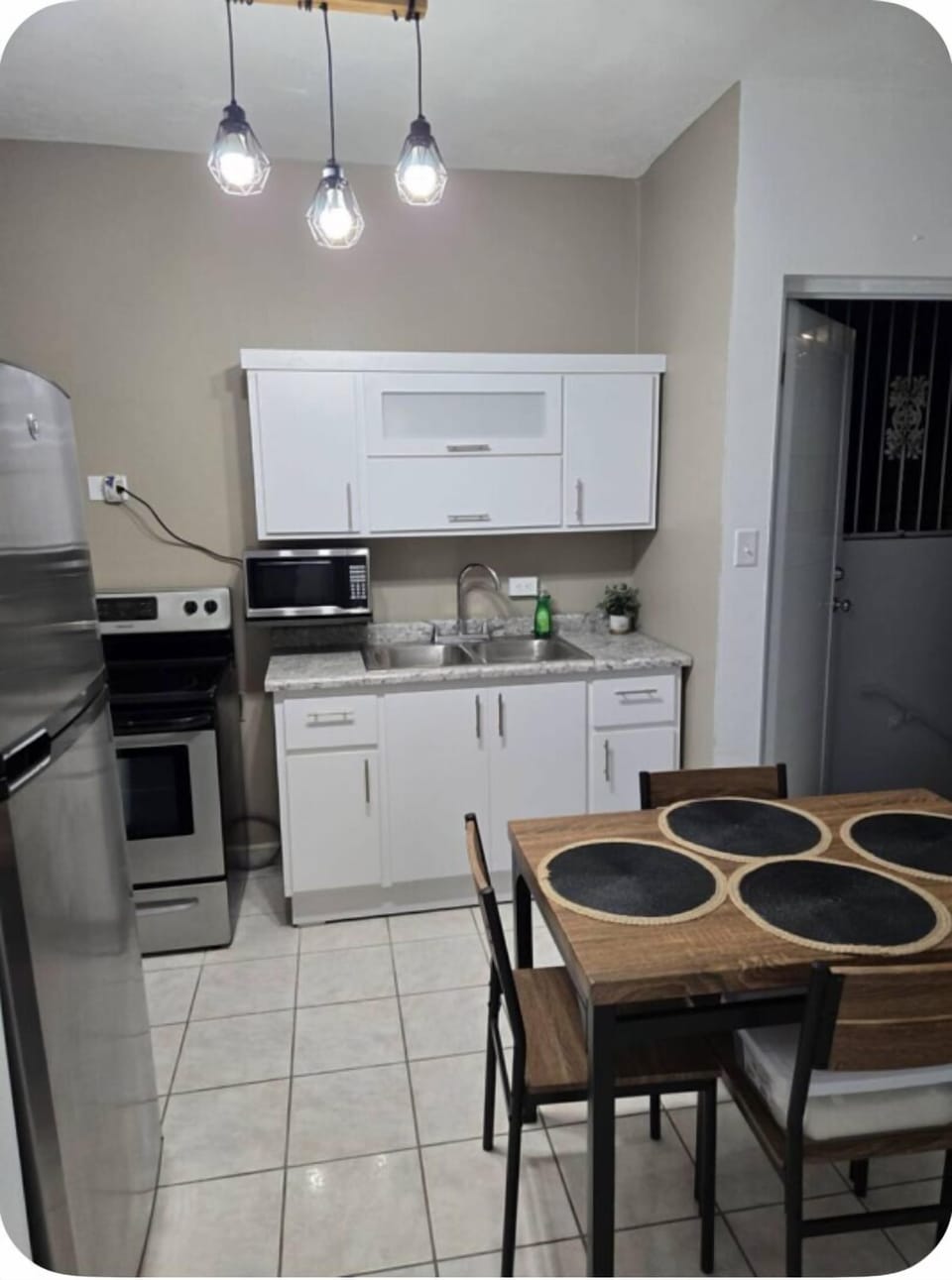 Full kitchen with microwave and toaster