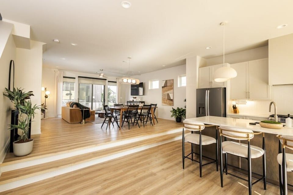 Spacious open concept kitchen, dining, and living area designed for comfort and seamless flow. With queen sized pull out