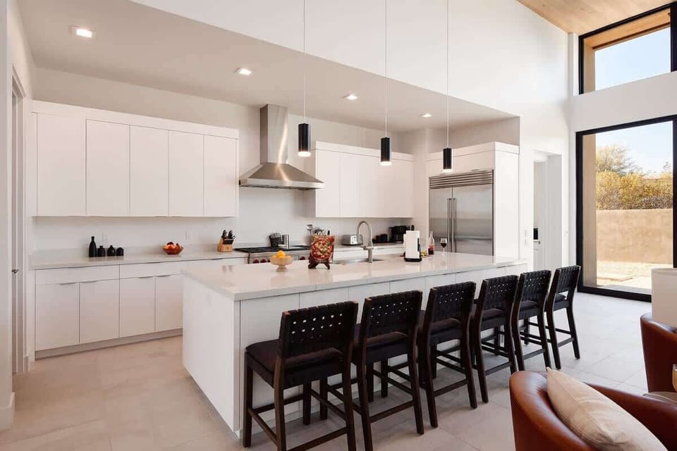 Fully equipped kitchen with stainless steal appliances and a large kitchen island with bar seating for 6 guests.