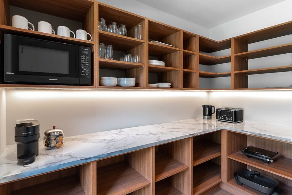Kitchen is well equipped with appliance such as a coffee machine and air fryer