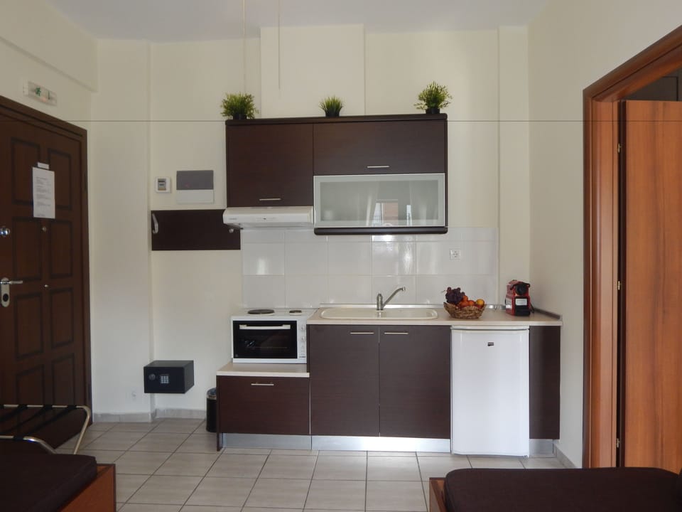 Mini-fridge, coffee/tea maker, electric kettle, cookware/dishes/utensils