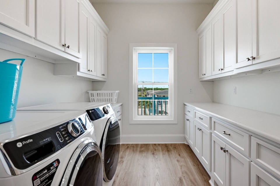 Spacious laundry room with full-size washer & dryer, tons of counter space and plenty of storage — especially handy for larger groups and longer stays