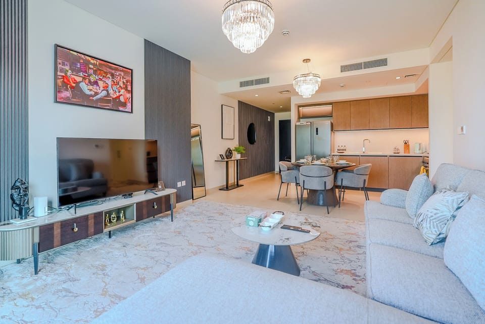 Deluxe Apartment, 2 Bedrooms, Balcony, City View | Living area | 55-inch Smart TV with digital channels