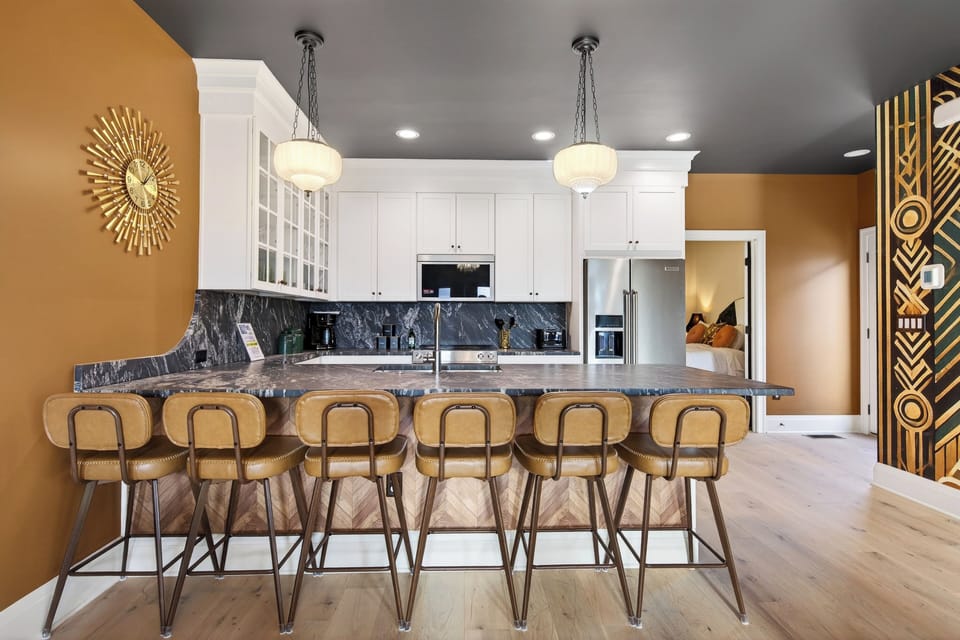 Designer kitchen with oversized island and bar seating for six.