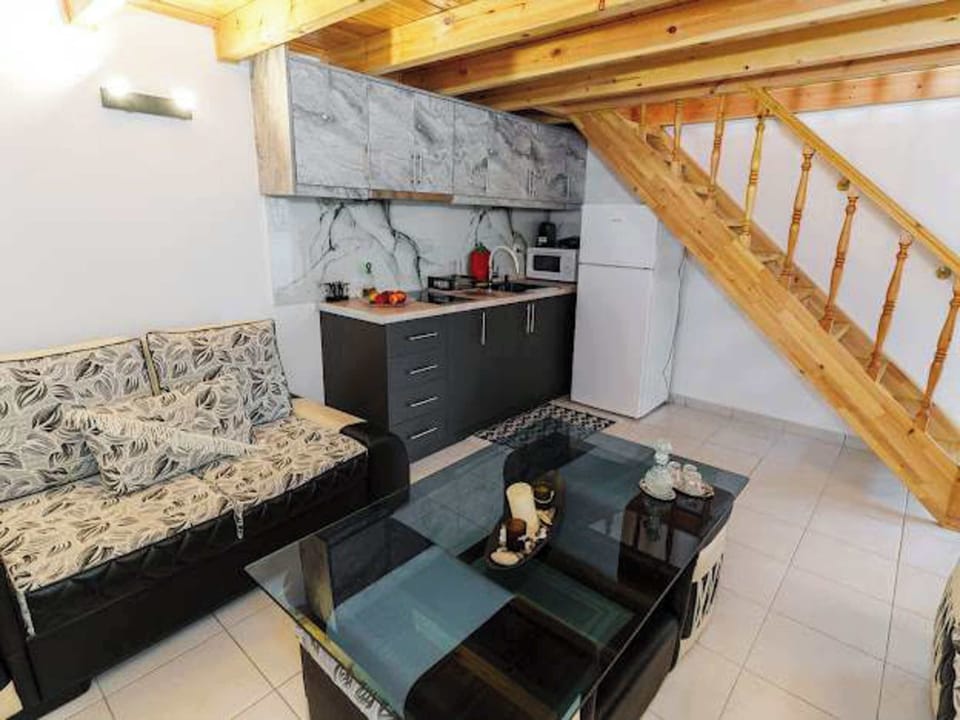 Living area with stairs leading to the upper level