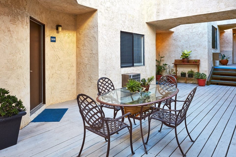 Sip morning coffee outside in a quiet courtyard setting.