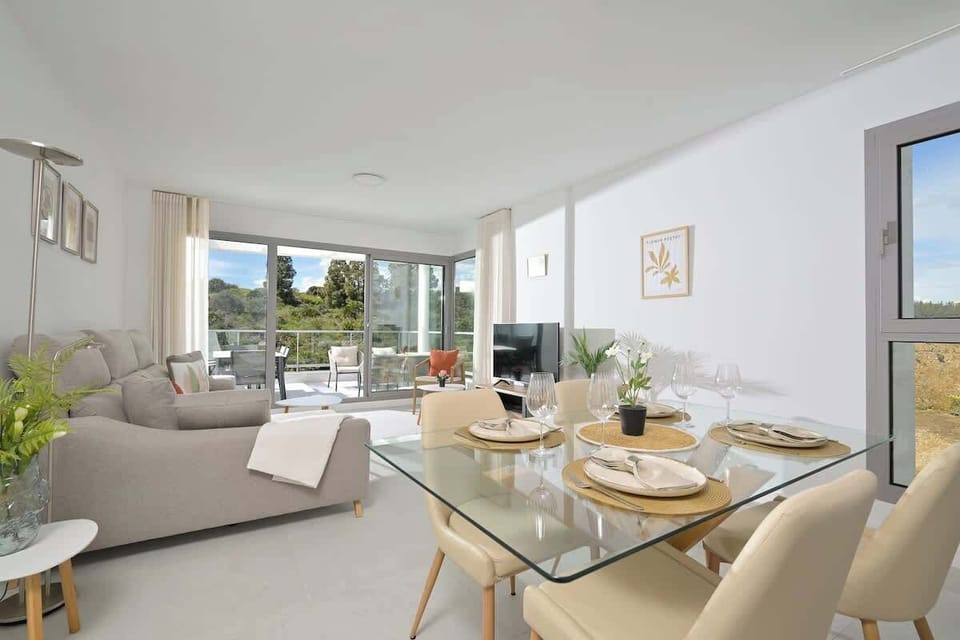 The open floor plan kitchen, dining table and living room
