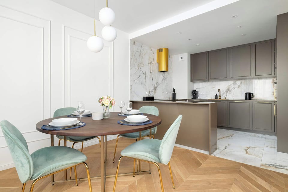 Refined dining corner with chairs placed next to the kitchen.