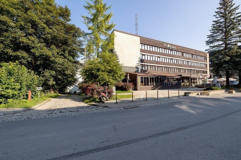 A nearby landmark or facility surrounded by trees, adding to the convenient location of the property.






