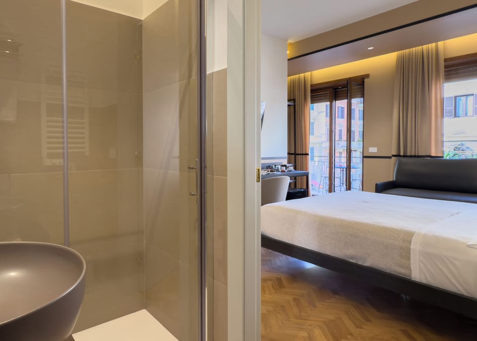 Deluxe Quadruple Room, Private Bathroom, City View | Free minibar, in-room safe, individually decorated
