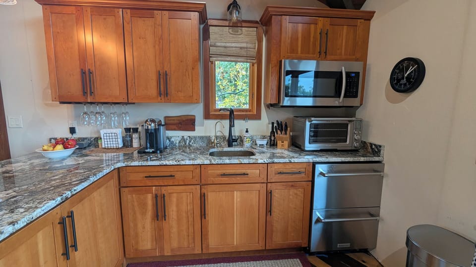 The kitchenette with Nespresso coffee maker, refrig and freezer with ice maker.