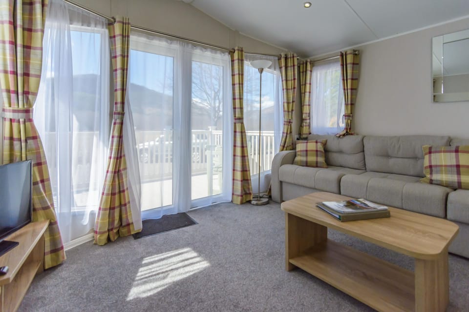 Lounge with doors to balcony
