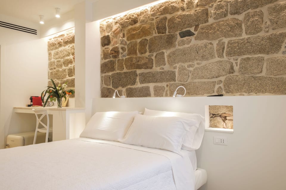 Comfort Room | Down comforters, pillowtop beds, free minibar items, laptop workspace